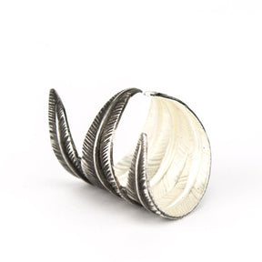 Silver cocktail ring with feathers