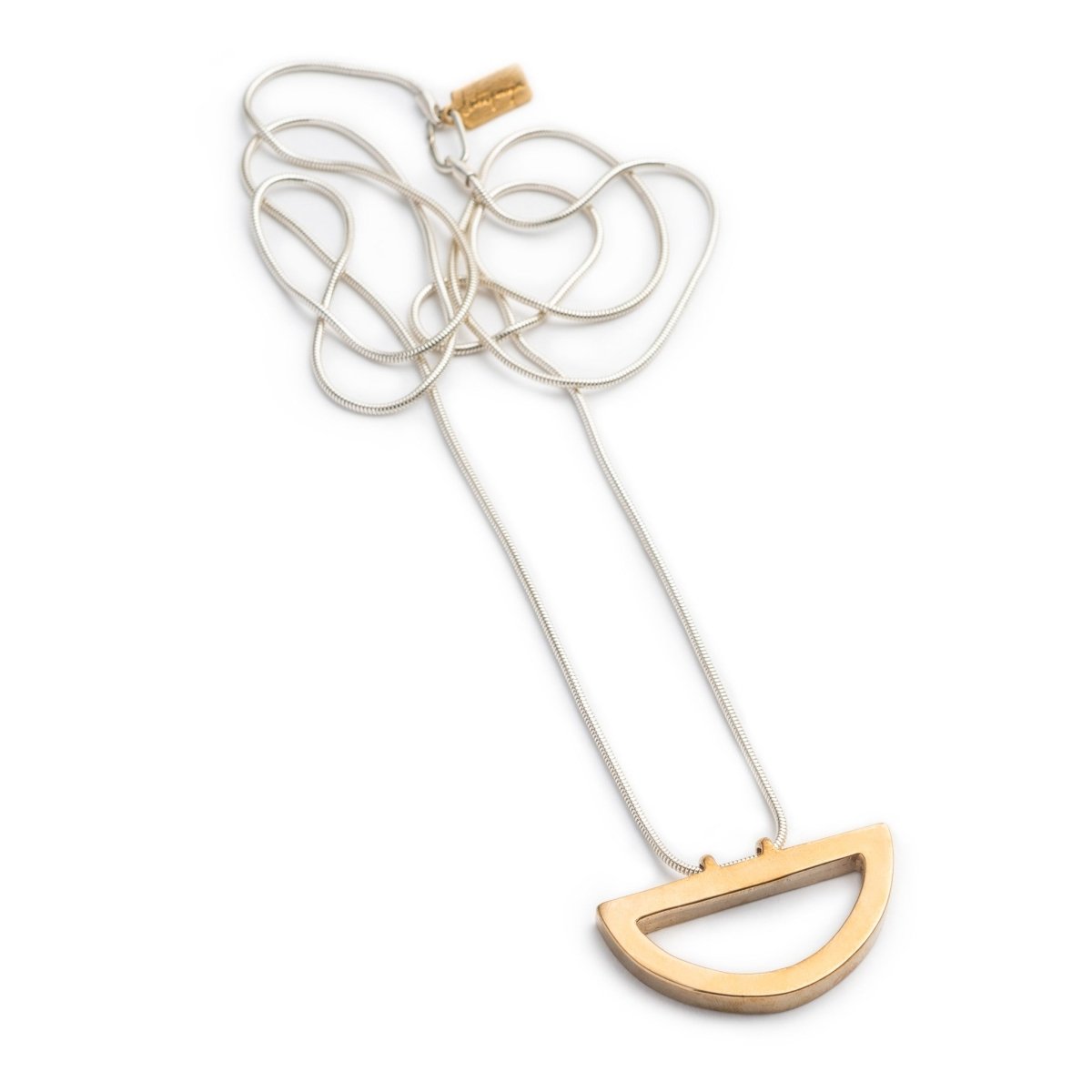 Long, sleek, sterling silver snake chain threaded along the long side of a cast bronze semicircle pendant. Hand-crafted in Portland, Oregon.