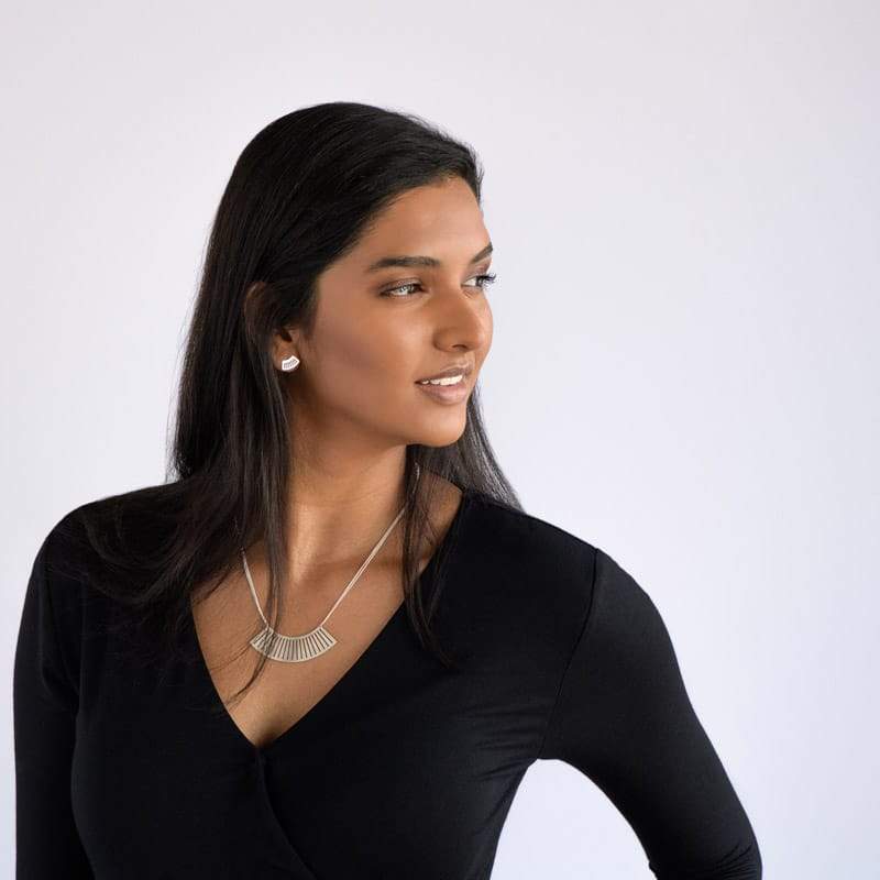 Ritmo mini fan stud in sterling silver on model