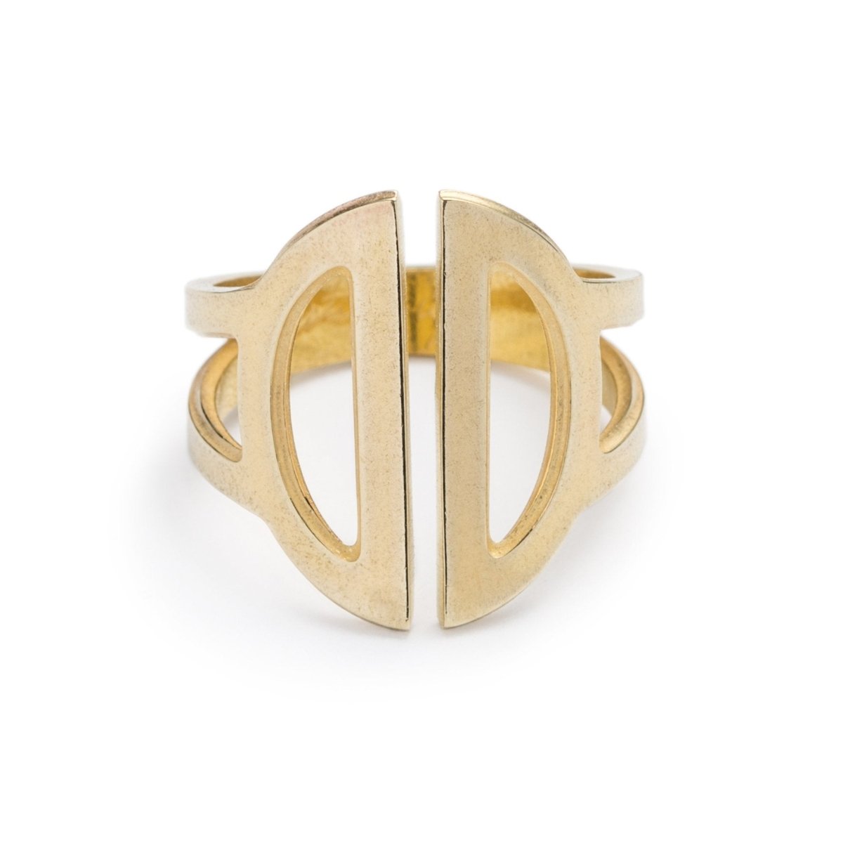 Wide, adjustable, polished brass ring, featuring two triangular cutouts on the band and a pair of semicircle cutouts as the focal point. Hand-crafted in Portland, Oregon.