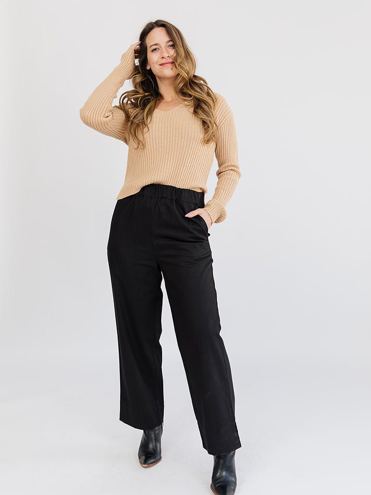 A straight leg loose denim pant in black with an elastic waist. The Rosie Pant in Black Denim is designed by Mata Traders and made in India.