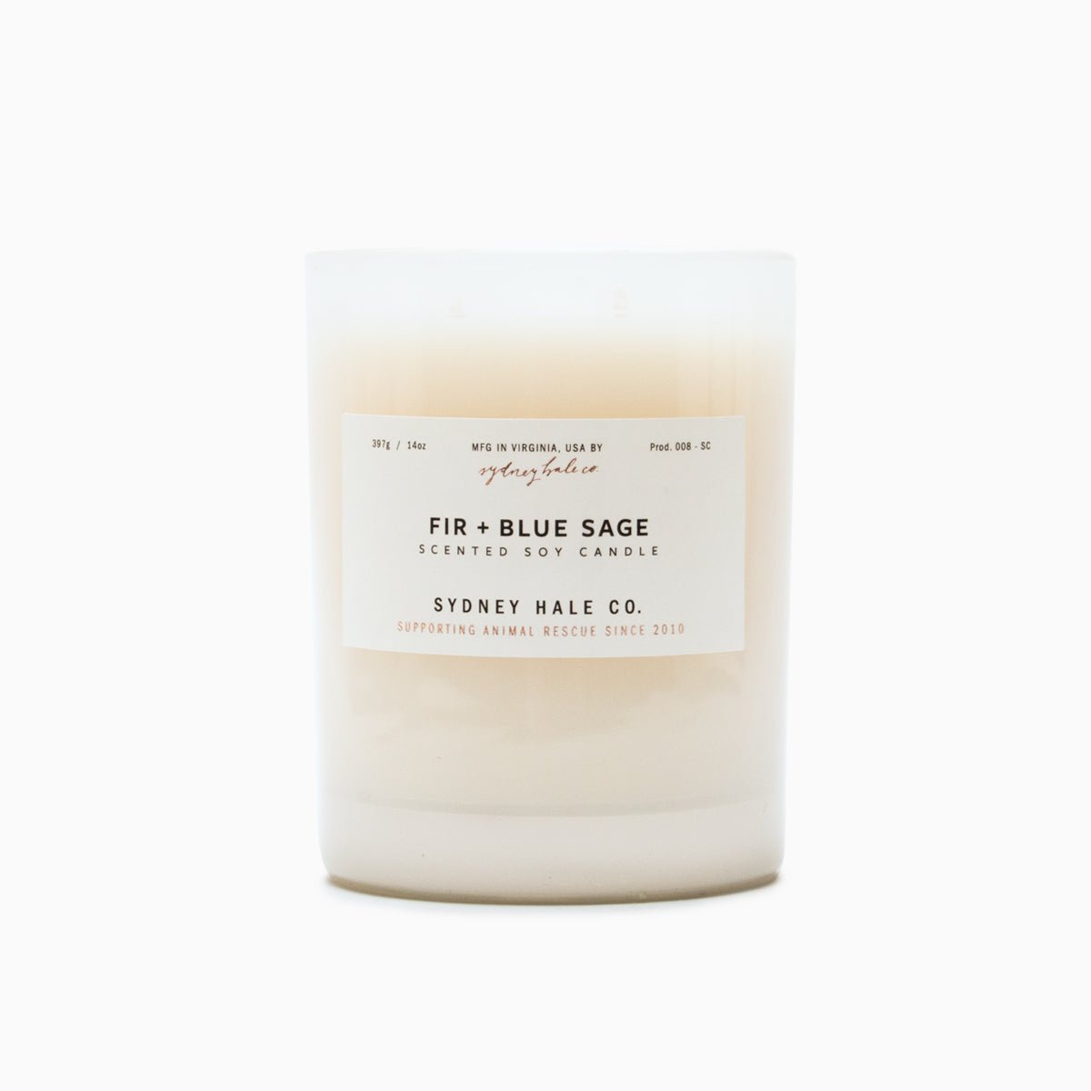 A cylindrical glass candle filled with a soy wax blend and two double cotton wicks. Label reads: "397g/14 oz. Manufactured in Virginia, USA by Sydney Hale Co. Fir + Blue Sage scented soy candle. Sydney Hale Co. Supporting Animal rescue since 2010."