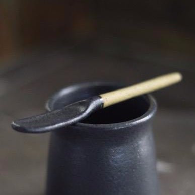 Stirring spoon made with stoneware clay with a matte black finish. Designed and hand built by Amy A Ceramics in Portland, Oregon.