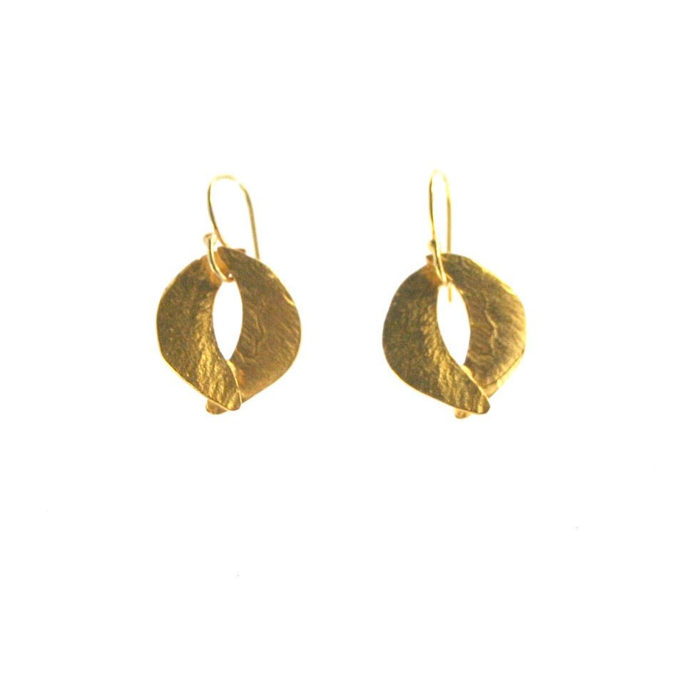 Two crescent shapes come together to form a circular dangle style earring. Made in cast brass and plated in 22kt gold. The Tiny Sculptured Earrings are designed by Lingua Nigra and handcrafted in Chicago, Illinois.