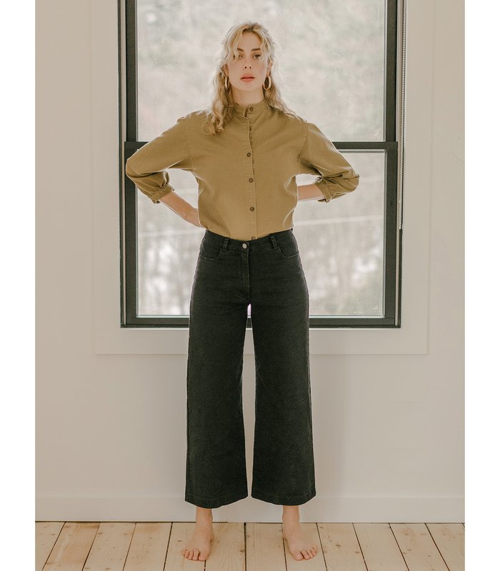 Model wears cropped wide leg jeans in Black. The Toni Jeans in Black are designed by Loup and made in New York City, USA.