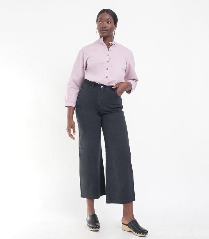 Model wears cropped wide leg jeans in Black. The Toni Jeans in Black are designed by Loup and made in New York City, USA.