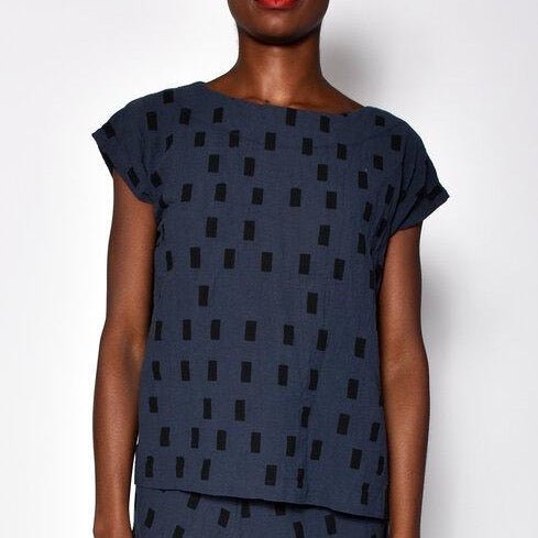 Navy blue short sleeve tunic with black square pattern. Designed and sewn by UZI in Brooklyn, New York.