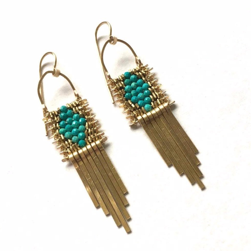 Round turquoise beads in a diamond shape with brass beads and brass tassels. Designed and handcrafted by Demimonde in Portland, Oregon.