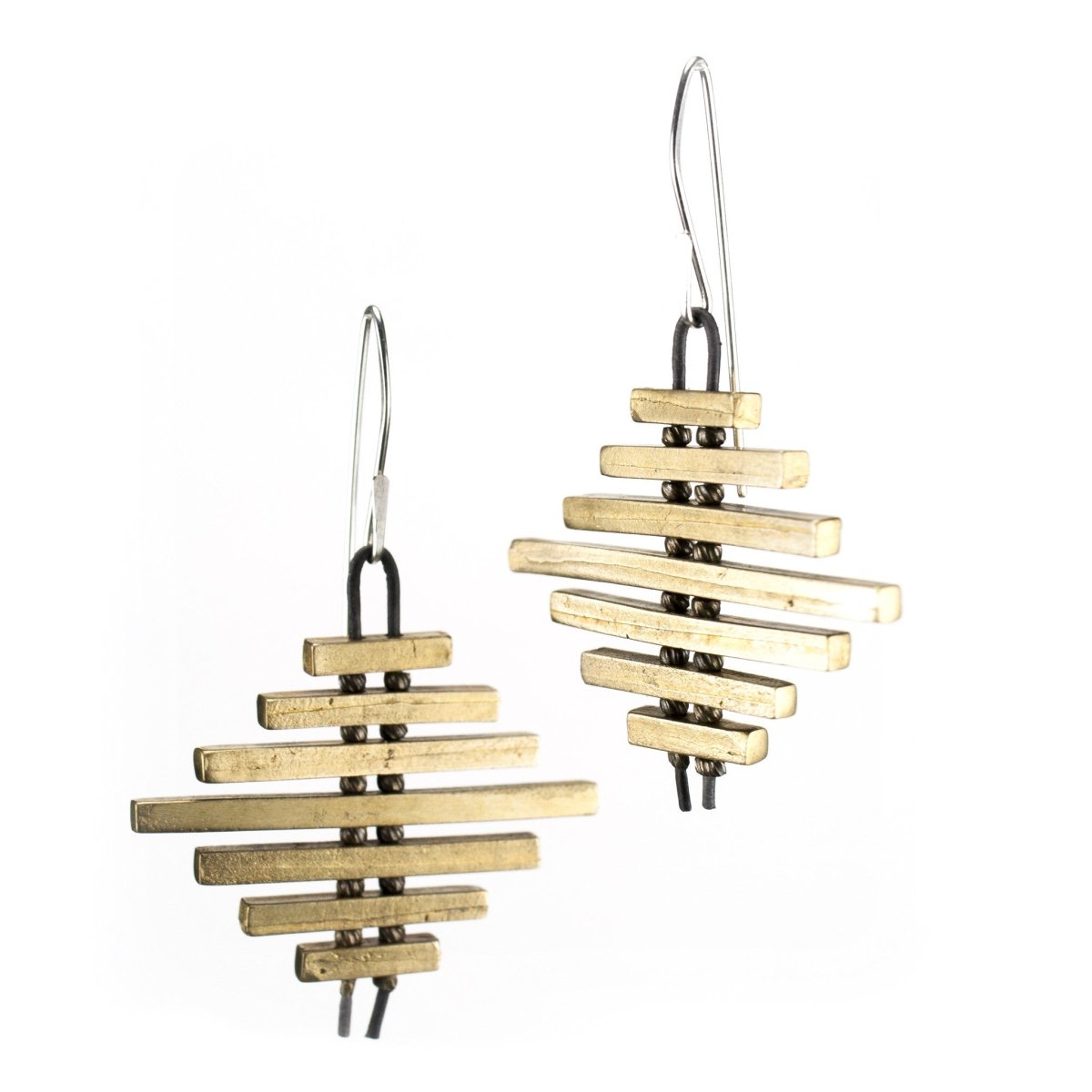 Cast bronze bar earrings threaded on leather.