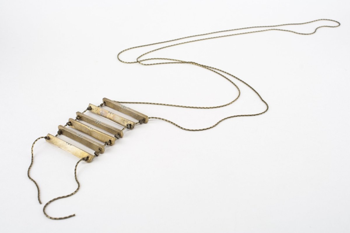 Painted necklace with multiple bars.