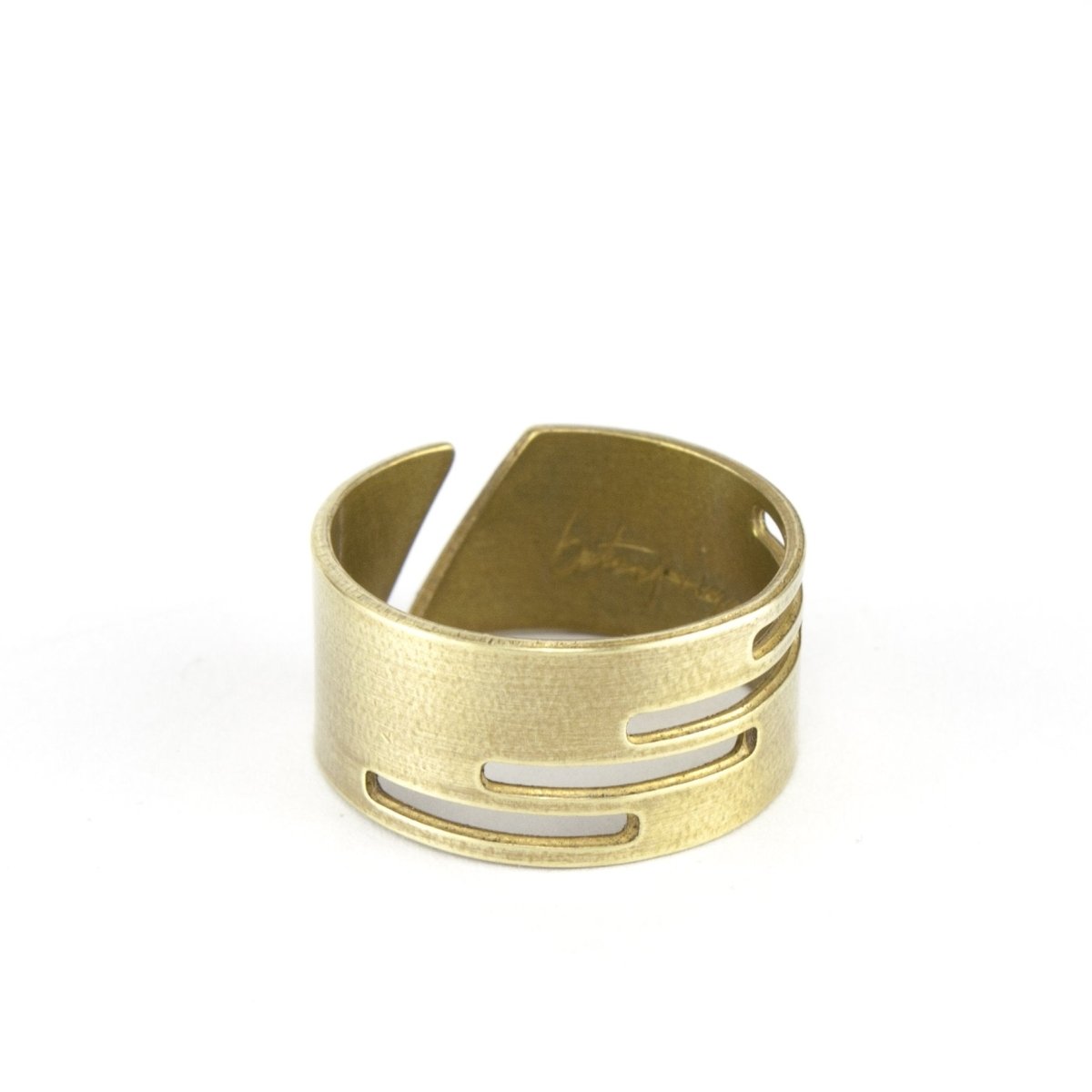Adjustable, brushed brass ring with stacked, rectangular cutouts on the band, and the betsy & iya logo etched inside the band. Hand-crafted in Portland, Oregon.