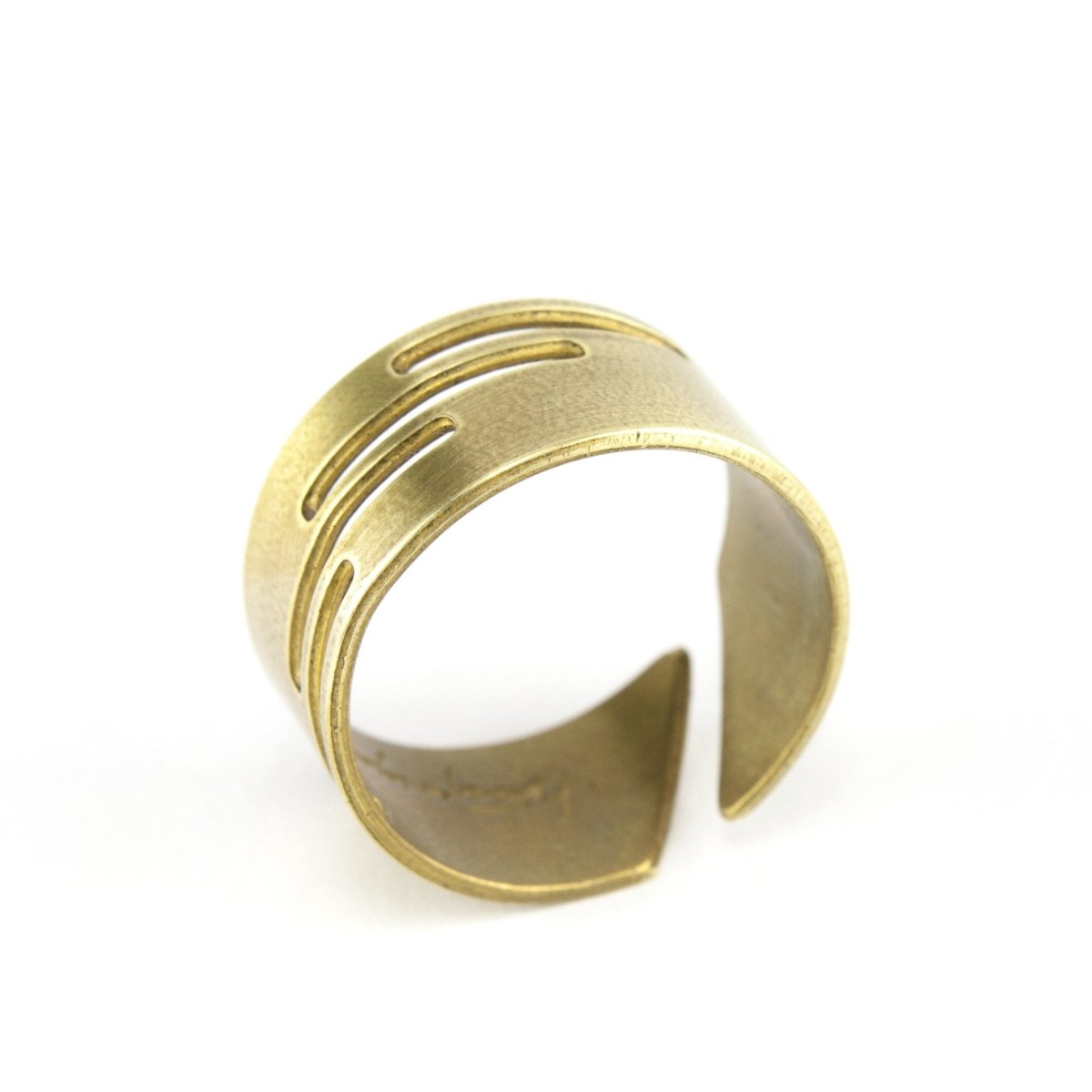 Adjustable, brushed brass ring with stacked, rectangular cutouts on the band, and the betsy & iya logo etched inside the band. Hand-crafted in Portland, Oregon.