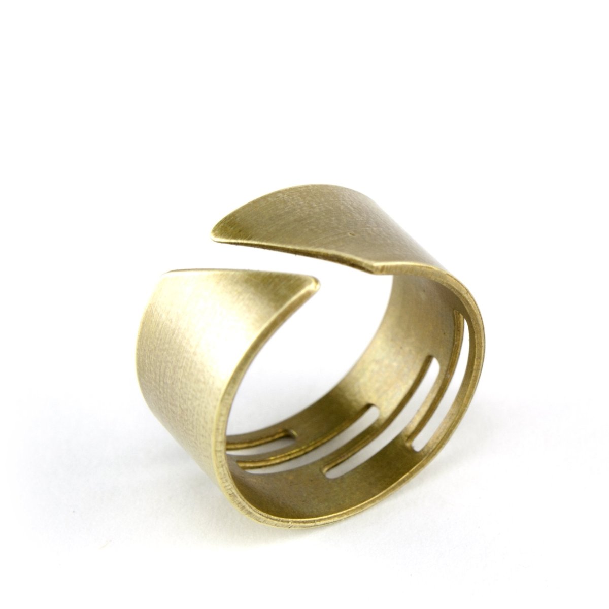 Adjustable, brushed brass ring with stacked, rectangular cutouts on the band, and the betsy & iya logo etched inside the band. Hand-crafted in Portland, Oregon.