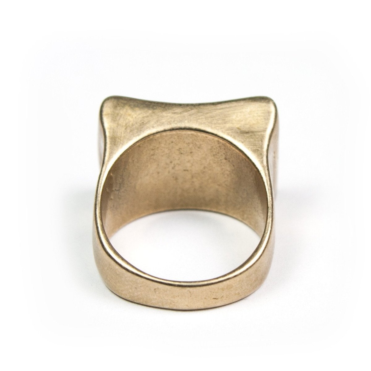 Bold bronze cocktail ring with curved rectangular top.