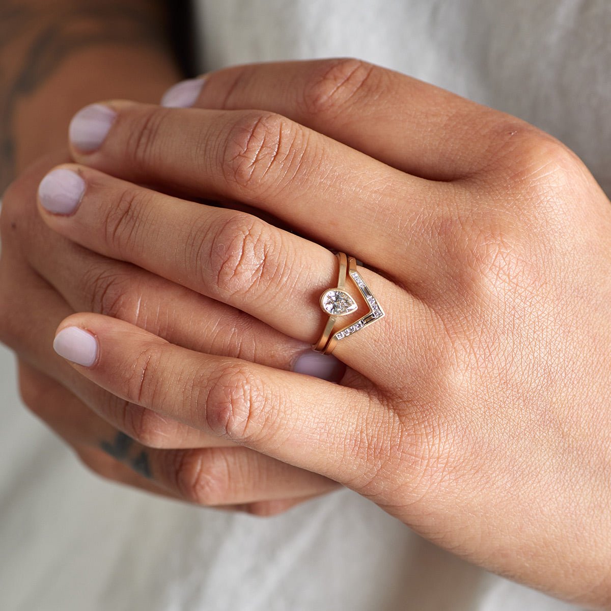 Model wears the Altus and Votum (0.5 ct) rings.