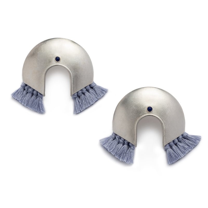Oversized, arc-shaped silver earrings with light blue cotton fringe and ethically sourced, fair trade lapis lazuli. Hand-crafted in Portland, Oregon.