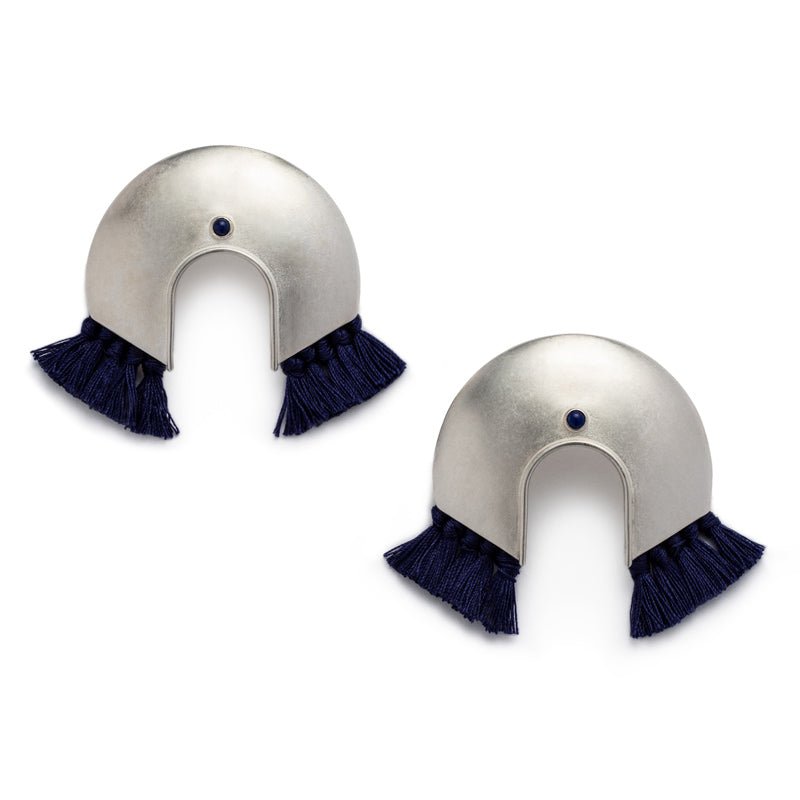 Oversized, arc-shaped silver earrings with navy cotton fringe and ethically sourced, fair trade lapis lazuli. Hand-crafted in Portland, Oregon.