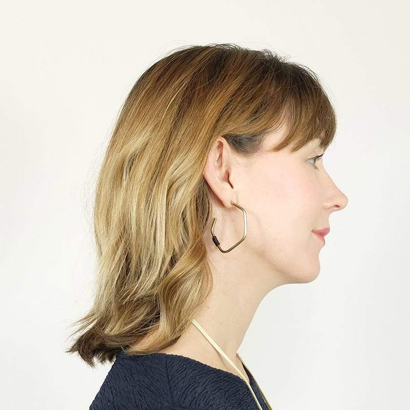 betsy & iya James John Hoop earrings with natural leather.