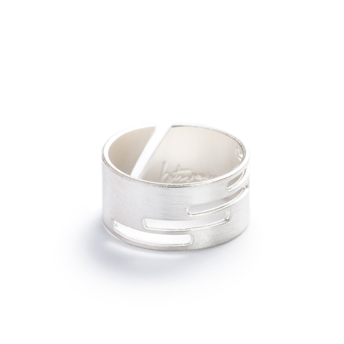 Adjustable, brushed sterling silver ring with stacked, rectangular cutouts on the band, and the betsy & iya logo etched inside the band. Hand-crafted in Portland, Oregon.