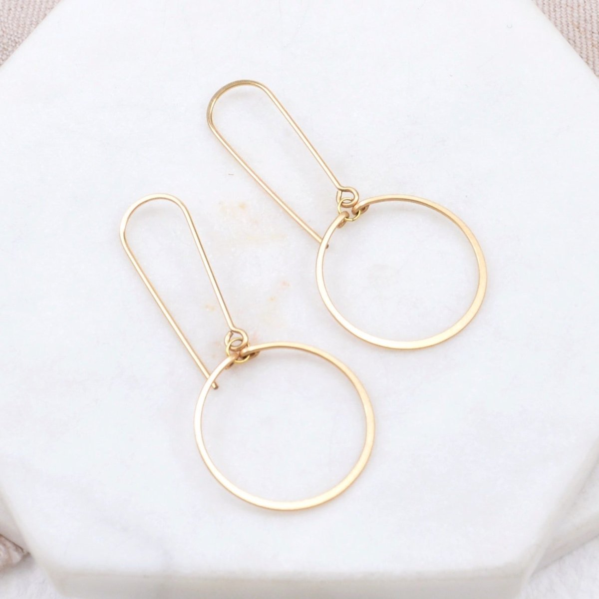 Delicate drop circle earrings formed out of gold-fill wire. Designed and handmade by Amy Olson in Portland, OR.