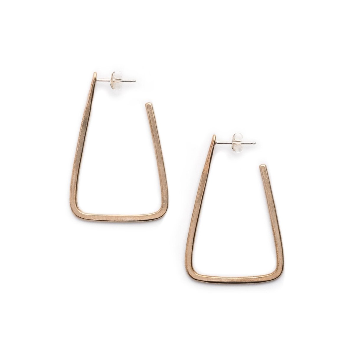 Simple, geometric, bronze hoop earrings with curved edges and a matte finish, sterling silver earrings posts, and sterling silver butterfly earring backings. Hand-crafted in Portland, Oregon.