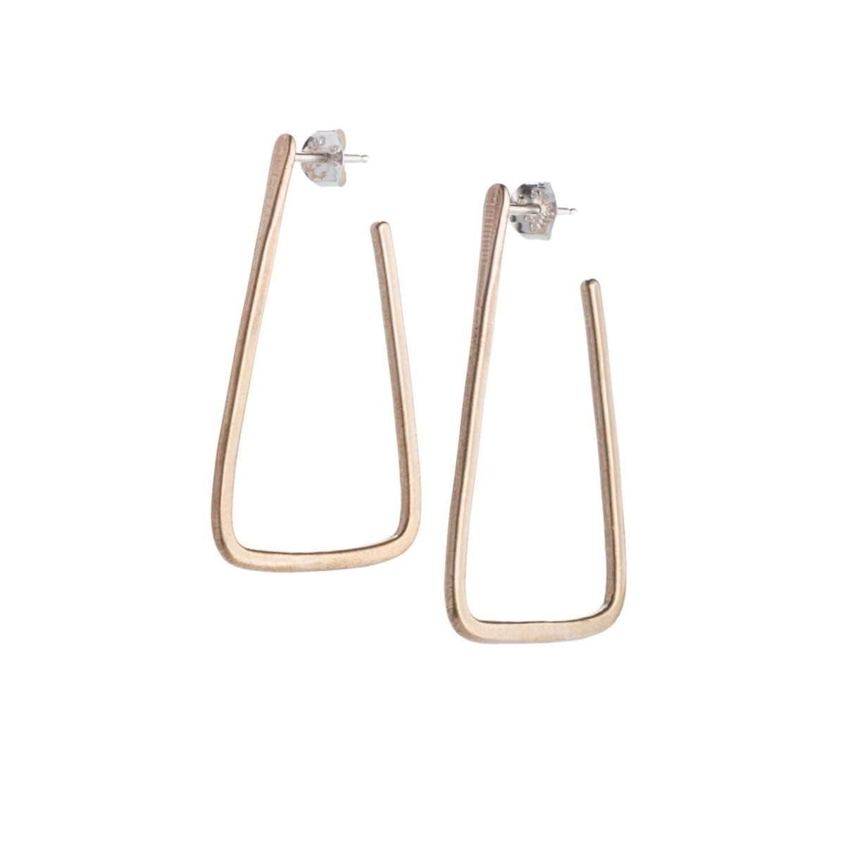 Simple, geometric, bronze hoop earrings with curved edges and a matte finish, sterling silver earrings posts, and sterling silver butterfly earring backings. Hand-crafted in Portland, Oregon.