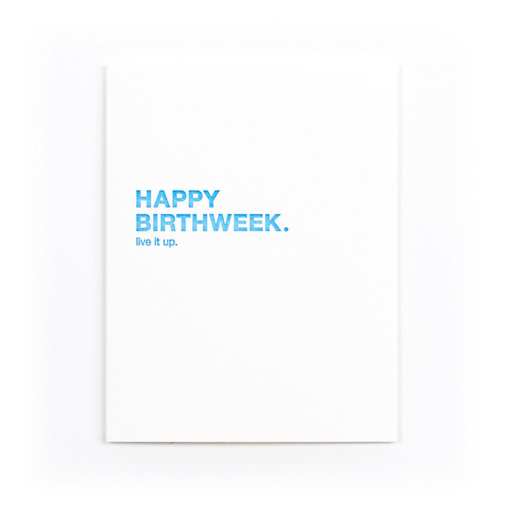 White card that reads: "HAPPY BIRTHWEEK. LIVE IT UP." Written in blue text. Designed by Sapling Press and printed in Pittsburgh, PA.