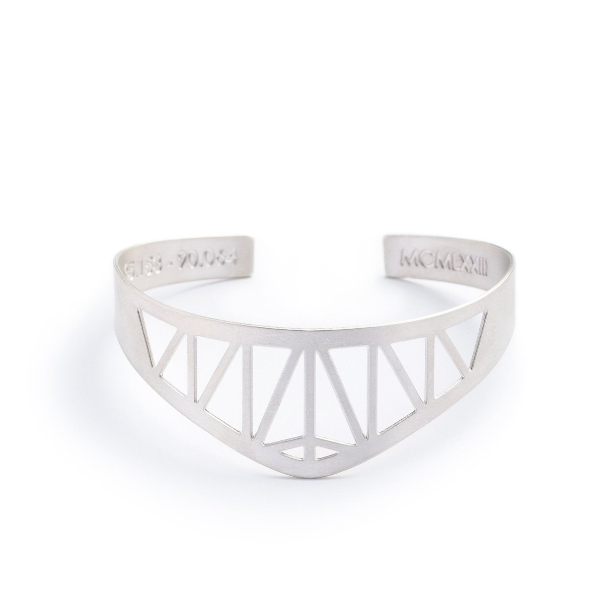 Modern, delicate, and adjustable silver-plated cuff bracelet modeled after the Hernando de Soto Bridge in Memphis, Tennessee, with the bridge's georgraphical coordinates and date of construction engraved on the inner cuff. Hand-crafted in Portland, Oregon.