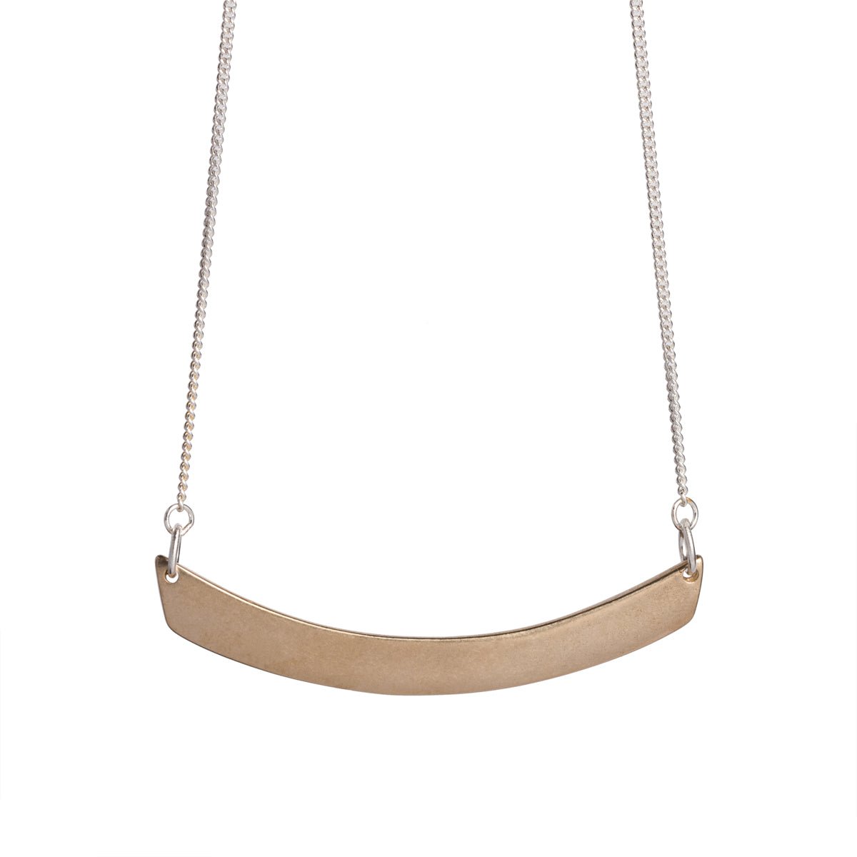 Minimal, curved, cast-bronze pendant, affixed to a sterling silver chain, with a hand-formed sterling silver clasp and closure. Hand-crafted in Portland, Oregon.