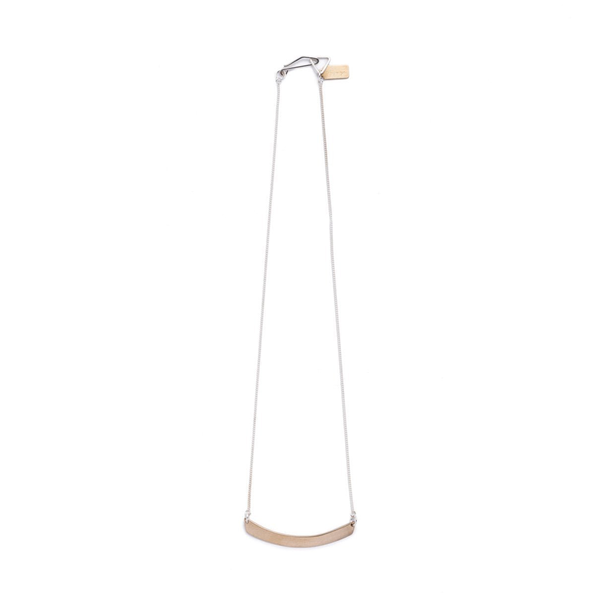 Minimal, curved, cast-bronze pendant, affixed to a sterling silver chain, with a hand-formed sterling silver clasp and closure and a brass betsy & iya logo tag. Hand-crafted in Portland, Oregon.