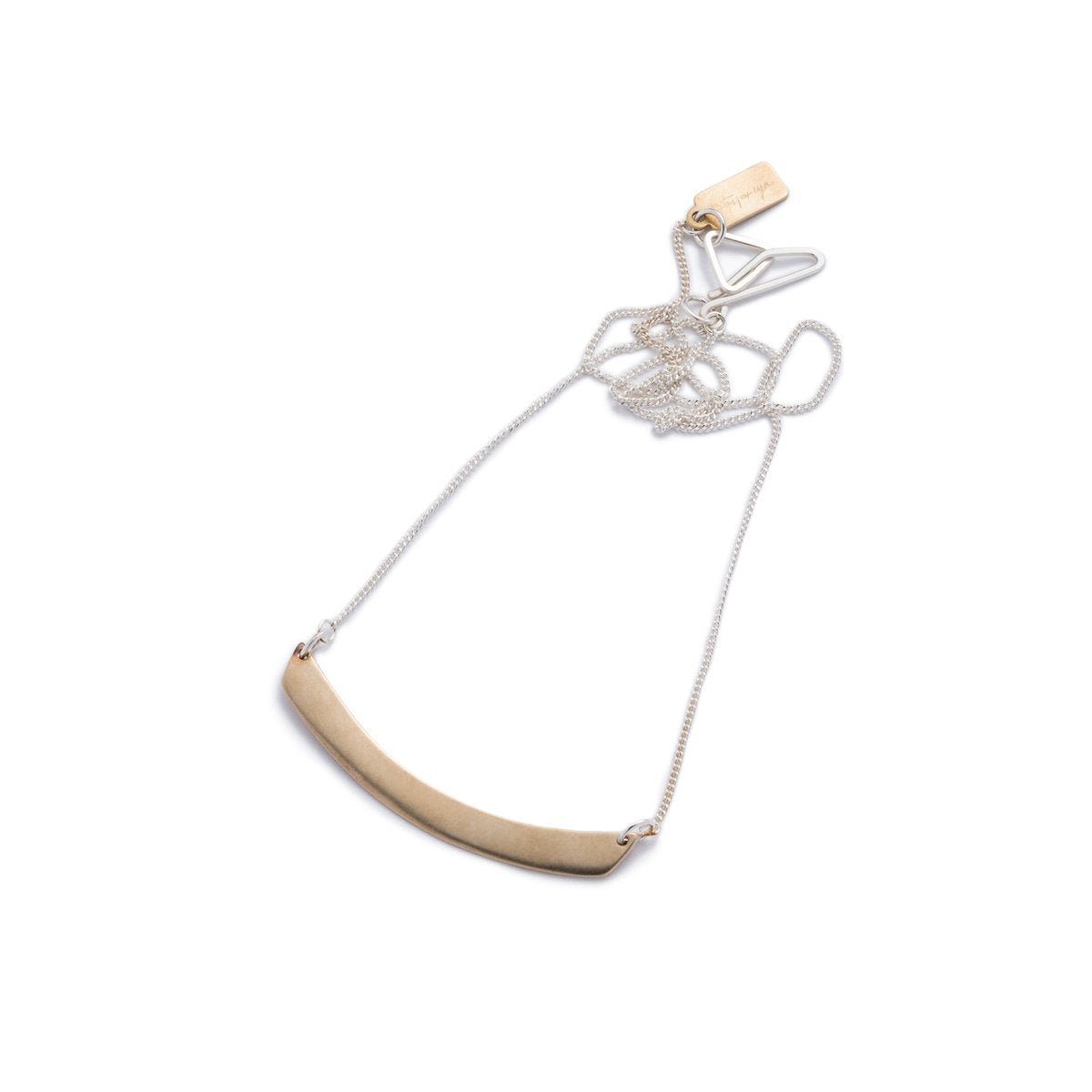 Minimal, curved, cast-bronze pendant, affixed to a sterling silver chain, with a hand-formed sterling silver clasp and closure and a brass betsy & iya logo tag. Hand-crafted in Portland, Oregon.