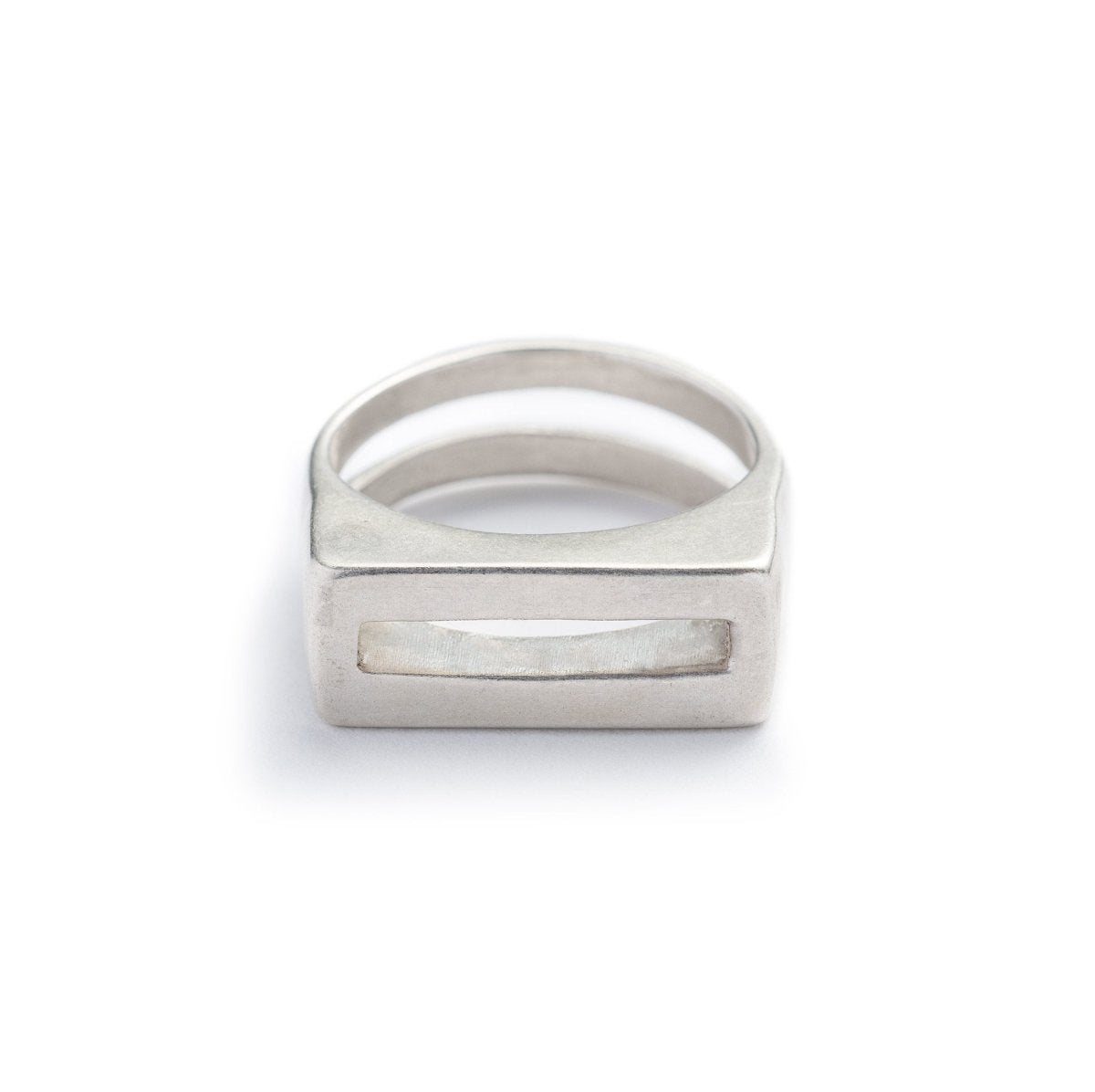 Solid, chunky, cast-silver ring with a flat top and rectangular cutouts on the band and the top of the ring. Hand-crafted in Portland, Oregon. 