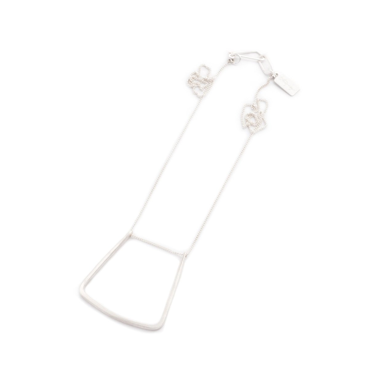Sterling silver chain with original betsy & iya findings threaded through a hand-formed, sterling silver, u-shaped pendant with squared edges. Hand-crafted in Portland, Oregon.