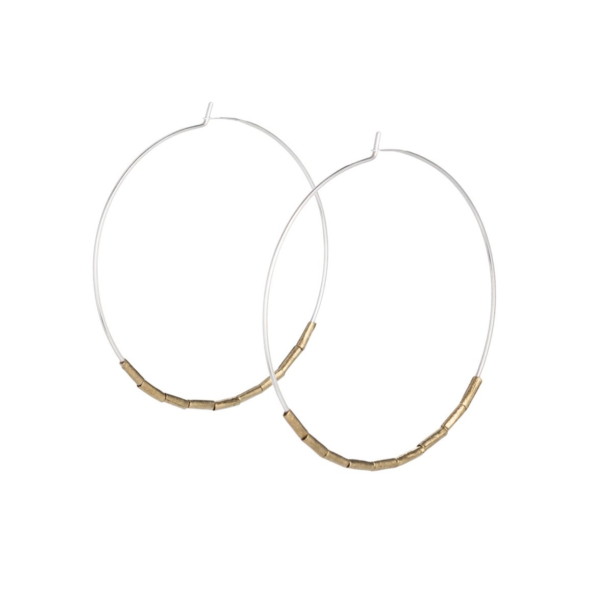 Lightweight, thin, sterling silver statement hoop earrings, accented with small, brass, African trade beads. Hand-formed in Portland, Oregon.