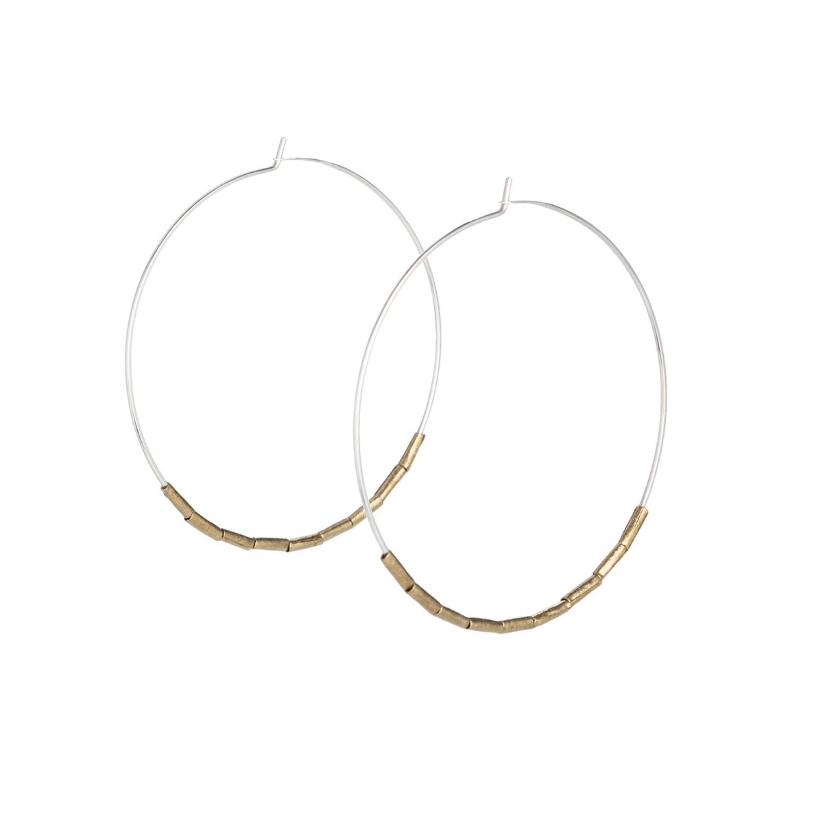 Lightweight, thin, sterling silver statement hoop earrings, accented with small, brass, African trade beads. Hand-formed in Portland, Oregon. 