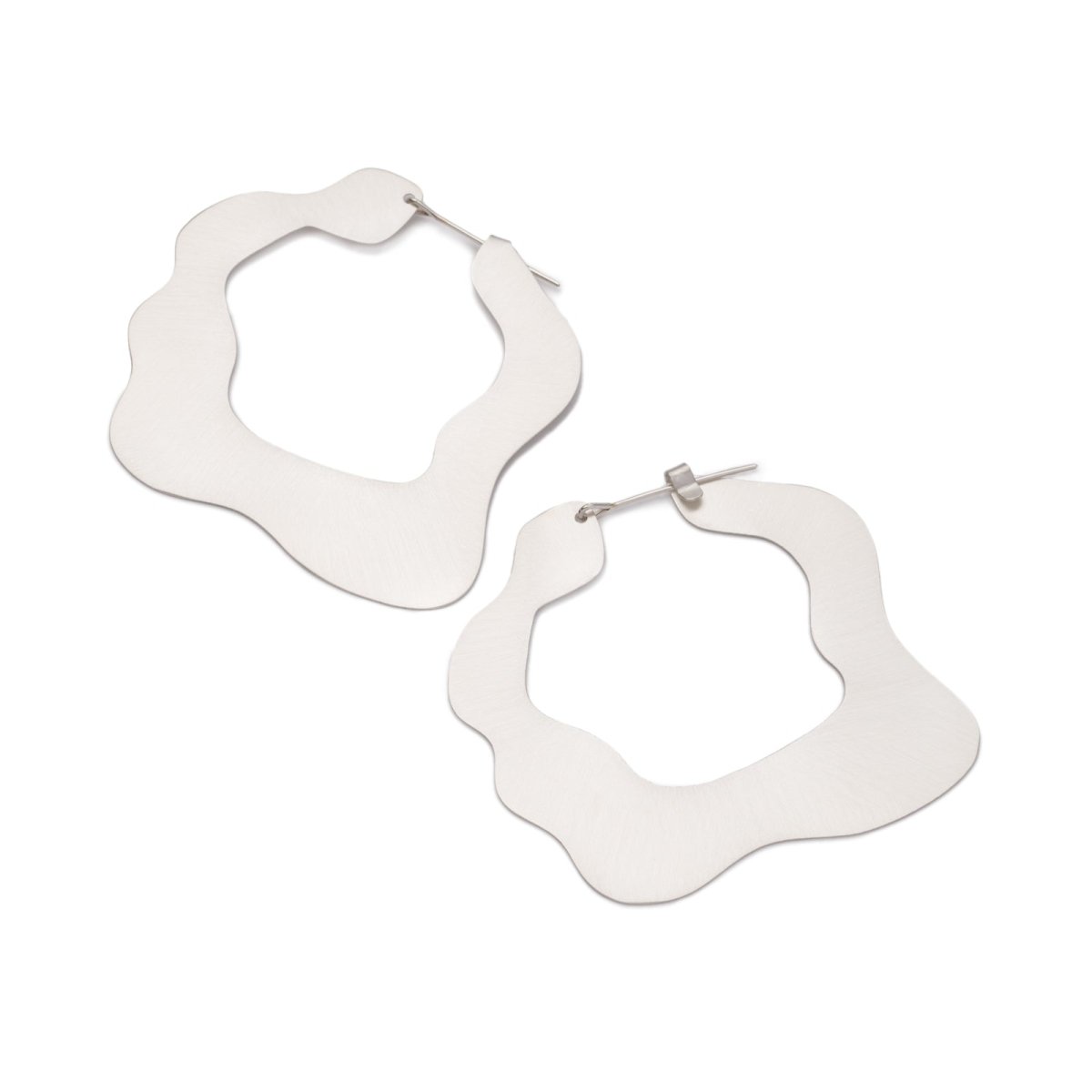 Large, glam, brushed sterling silver statement hoop earrings, featuring a flat profile and curvy edges, and completed with sterling silver-filled ear wires. Hand-crafted in Portland, Oregon.