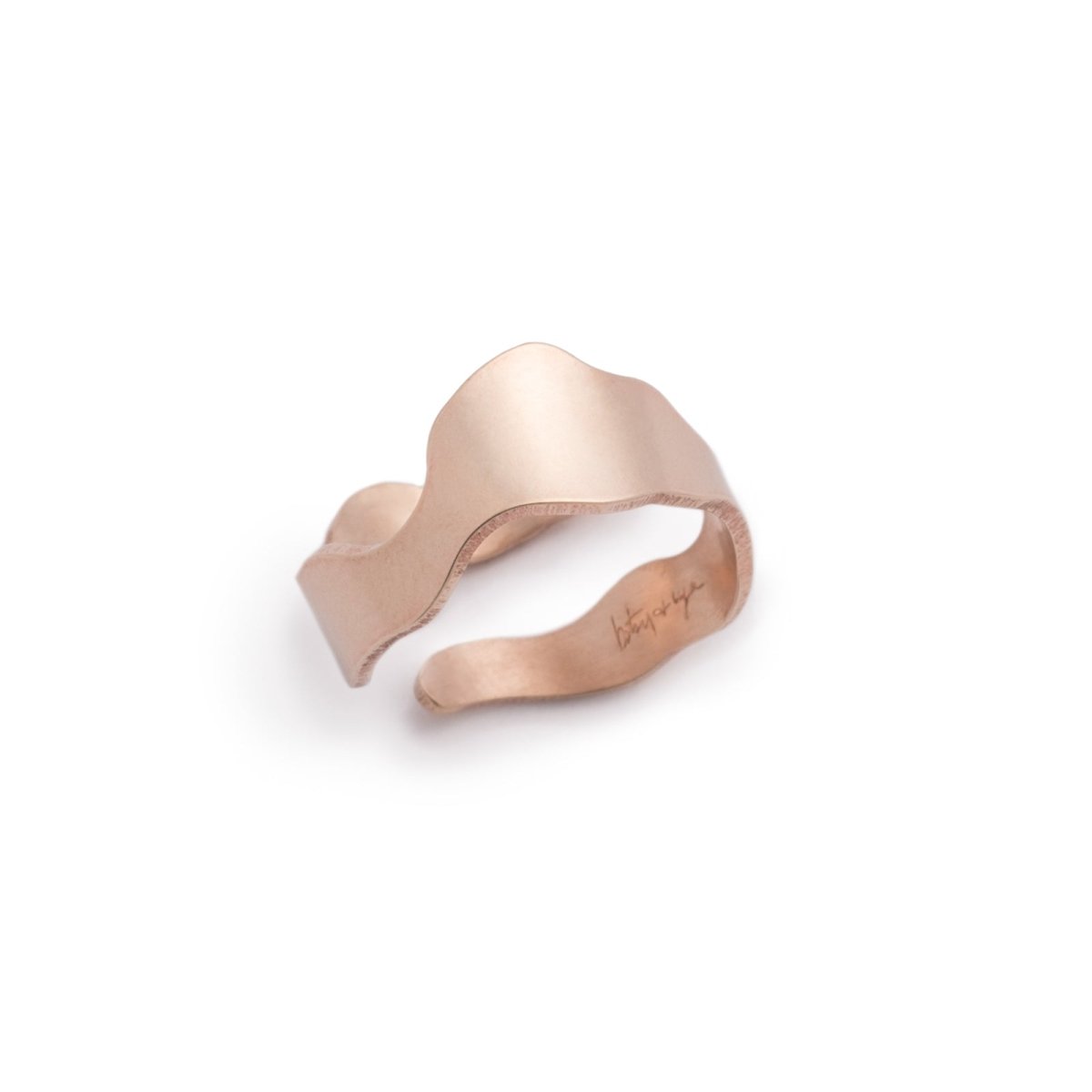 Sleek and simple brushed bronze adjustable ring, featuring a wavy shape inspired by Portland's Willamette River and the betsy & iya logo etched inside the band. Hand-crafted in Portland, Oregon.