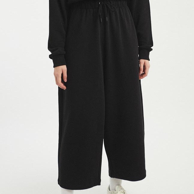 A wide leg loose fitting pant with an elastic tie waistband. The Wanda Pants in Black are designed by Rita Row and made in Girona, Spain.