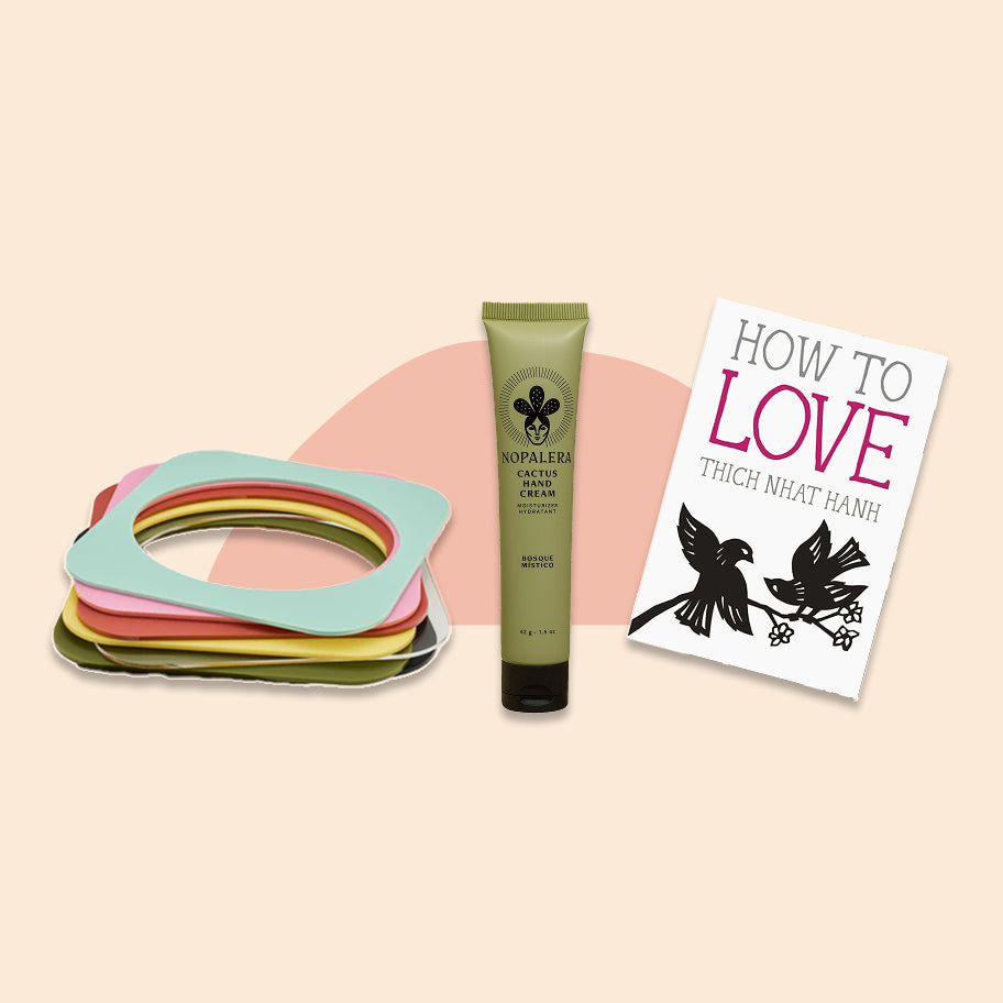 Nopalera skincare cream tube, colorful bracelets, and a book titled 'How to Love' on a beige background