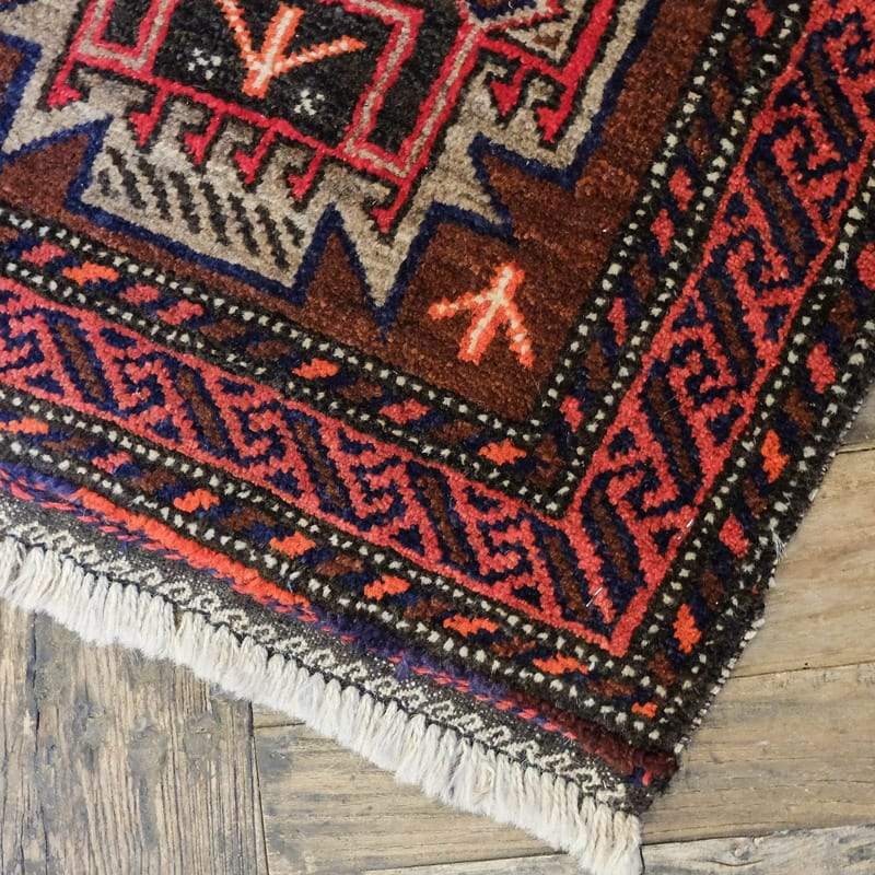 Baluchi Wool Rug in Brown and Red with Green Zig Zags