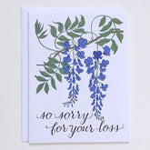White card with an illustration of a Wisteria in green and periwinkle. Text at the bottom reads: "SO SORRY FOR YOUR LOSS" in black script. Made with recycled paper by Banquet Atelier in Vancouver, British Columbia, Canada.
