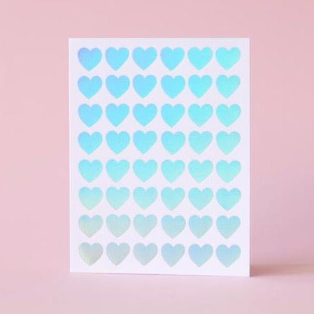 White greeting card with rows of iridescent hearts. Measures 4.25x5.5" and printed in Portland, Oregon.