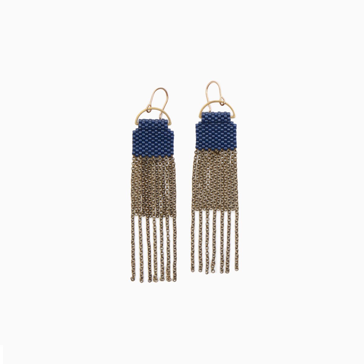 A pair of navy blue beaded earrings with long strands of antique brass chain secured around a small brass hoop. The Curtain Earrings in Navy are designed and handcrafted by A Nod to Design in Portland, OR.