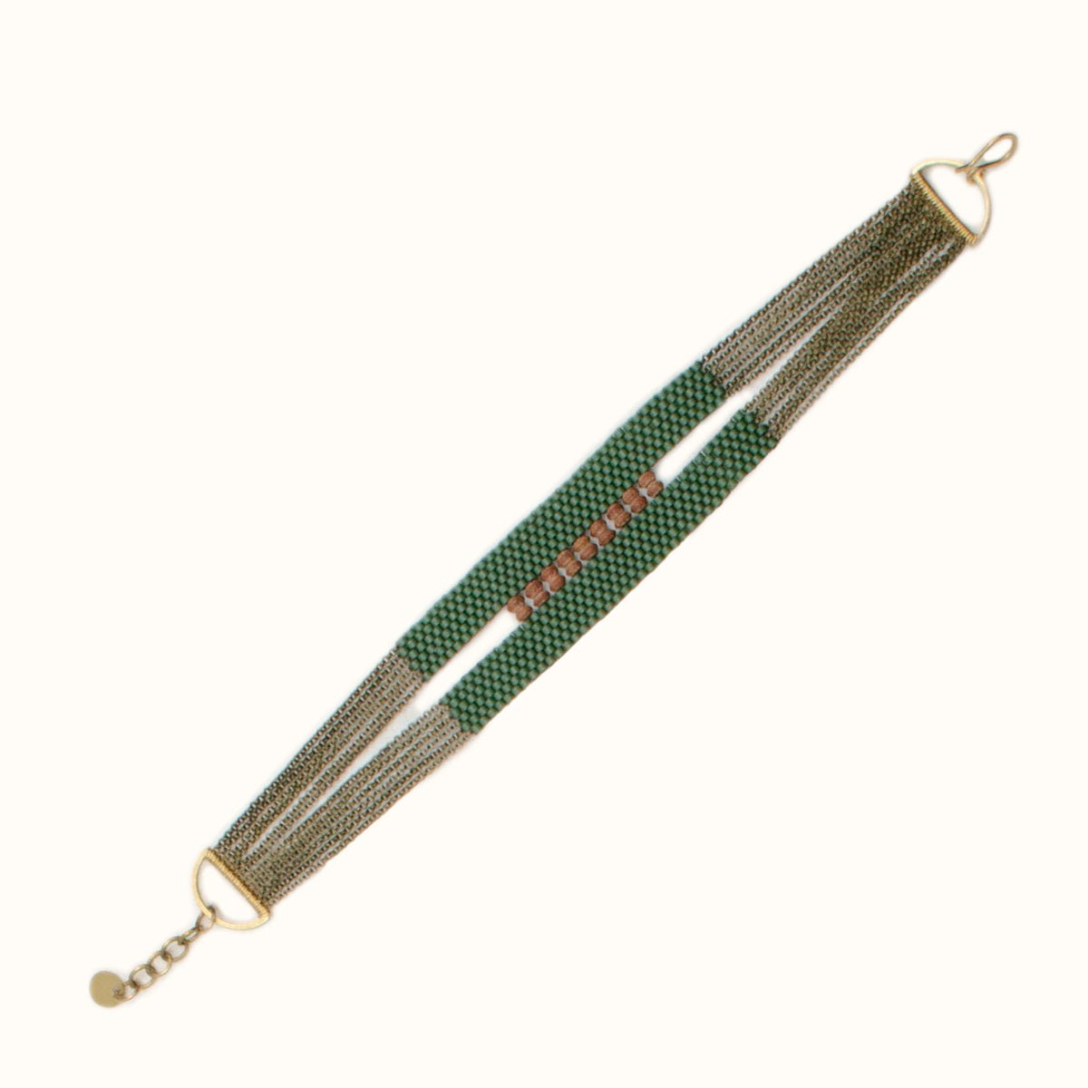 Ladder Bracelet made with moss green and Afghani serpintine beads on antique brass chains. Handmade by A Nod To Design in Portland, OR.