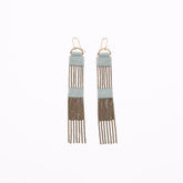 Two tier blue grey beaded dangle earrings connected by strands of antique brass chains. Designed and handmade by A Nod To Design in Portland, Oregon.