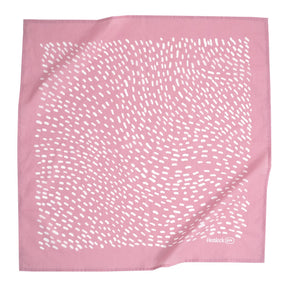 A mauve bandana with a dotted white pattern. Designed by Hemlock Goods in Fulton, MO and screen printed by hand in India.