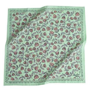 Mint bandana with pale pink and white floral pattern. Designed by Hemlock Goods and screen printed by hand in India.