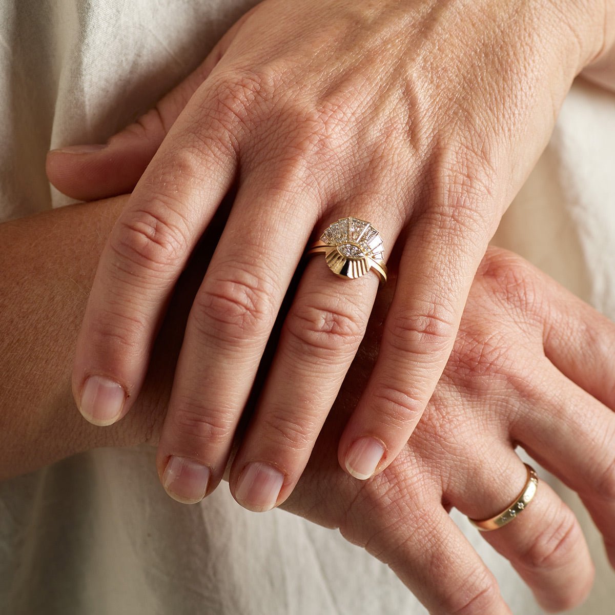 Model wears the Apricus ring stacked on top of the Aestus ring on their left hand.