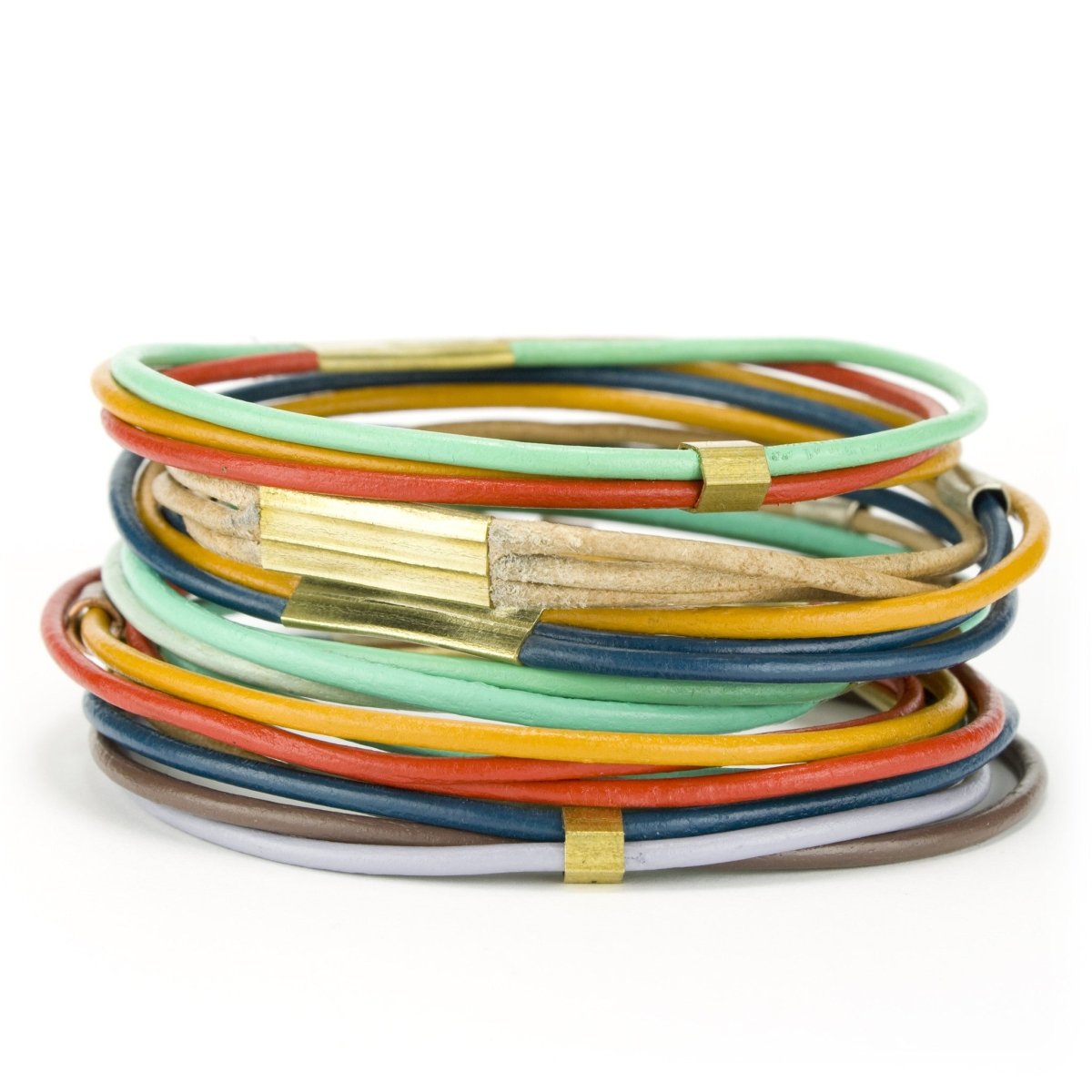 A large stack of all the different leather bangle bracelet colors betsy & iya offers.