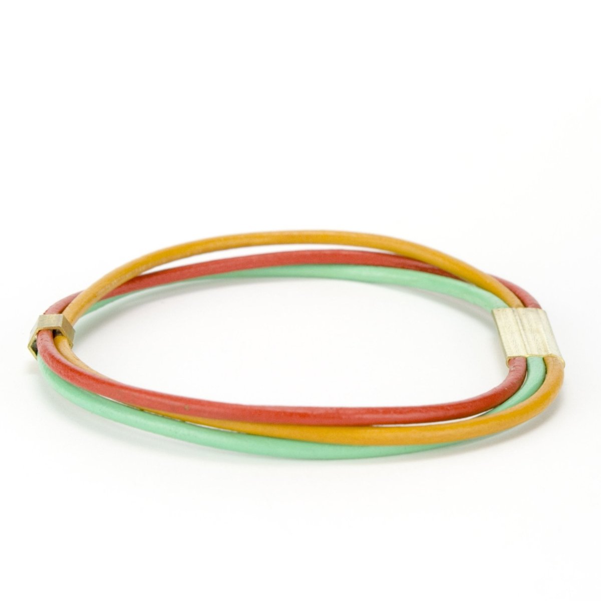 The red, marigold, mint color combo of the betsy & iya leather bangles.